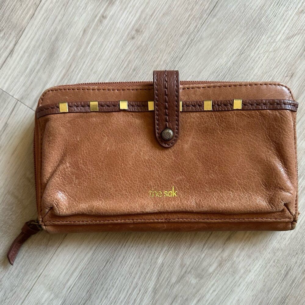 The Sak Brown Leather Brass Accent Iris Wallet with Wristlet Strap 107467